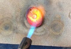 an object that looks like a ball being blown by a blower on the ground