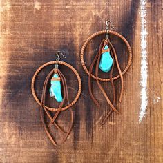 -These bold hoop earrings are part boho and part badass.  Made from soft rust deerskin leather and turquoise howlite stones.  -Total length from the top of the hook to the tip of the leather tassel is 6” - 6.5”.-Earwires are antique-brass.  Goldfill earwires are available by request. -Deerskin leather is sustainably sourced in the USA.-Ok to get wet.-Available in 7 colors.-Designed and handmade in South Pasadena, CA.Check out more of our lovely earrings here:https://www.etsy.com/shop/ASTALIJewel Bohemian Brown Wire Wrapped Hoop Earrings, Unique Handmade Turquoise Hoop Earrings, Artisan Turquoise Hoop Earrings, Turquoise Hoop Jewelry For Festival, Bohemian Brown Pierced Hoop Earrings, Bohemian Hoop Wrap Earrings, Handmade Southwestern Turquoise Hoop Earrings, Turquoise Hoop Earrings For Festival, Rustic Handmade Hoop Earrings