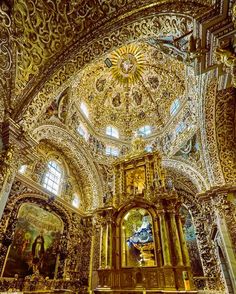 the interior of an ornately decorated church