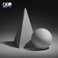 an egg sitting on top of a white object in the middle of a black and white photo