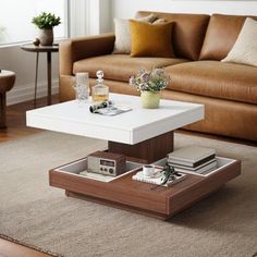 This rustic-vintage coffee table blends modernity with farmhouse charmfeaturing wood grain and solid color surfacesIts minimalist design with clean lines complements any furnitureThe unique 360rotating top accommodates storage and decorensuring easy accessThree versatileremovable trays offer flexible organizationMade of sturdy MDF and hardwareit ensures durabilityWater-resistant and easy to cleanthis table is a practicalstylish addition to your living spaceWrought StudioTable Top ColorWhiteWrou Wood Accent, Living Room White, Table With Storage, Coffee Table Vintage, Vintage Farm