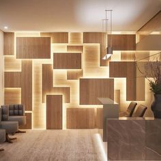 a living room filled with lots of furniture next to a wall covered in wooden blocks