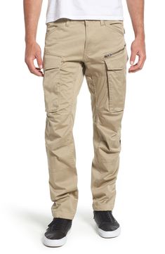 Stretch-cotton pants in a tapered profile rock a modern, utilitarian look with cargo-style pockets and ergonomic seaming for a more active fit. 32" inseam; 14" leg opening; 10" front rise; 15" back rise (size 32) Zip fly with button closure Side slant pockets; back flap pockets; side cargo pockets 97% cotton, 3% elastane Machine wash, dry flat Imported Fit Cargo Pants, Linen Shirt Men, Mens Cargo, Rock A, G Star Raw, Nordstrom Store, Cotton Pants, Fashion Street, Linen Shirt