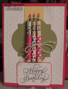 a happy birthday card with three candles on it and a tag that says happy birthday