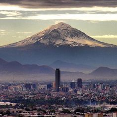 a view of a city with a mountain in the background