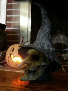 a carved pumpkin sitting on top of a wooden table