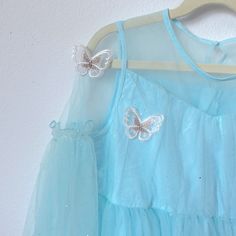 Butterfly Fairy Dress 7-8t. Never Worn Cute Blue Fairy Dress For Party, Blue Fairy Dress For Party, Blue Fairy Dresses For Party, Silver Princess Dress For Dress-up, Blue Fairy Dress For Spring Party, Cute Blue Fairy Dress For Summer, Blue Spring Fairy Dress For Party, Blue Fairy Party Dress, Light Blue Long Sleeve Princess Dress For Party