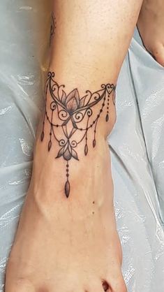 a woman's foot with a tattoo on it