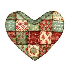 a patchwork heart shaped pillow with red, green and white designs on the front