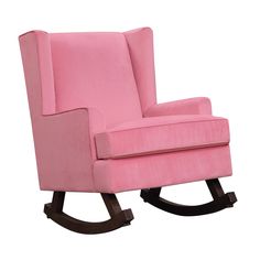 a pink rocking chair sitting on top of a wooden floor