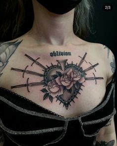 a woman with a cross and roses tattoo on her chest