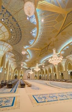 an ornately decorated hall with chandeliers and lights