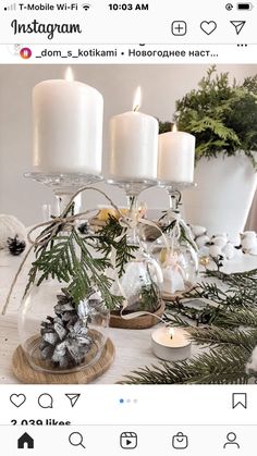 a table topped with candles and christmas decorations