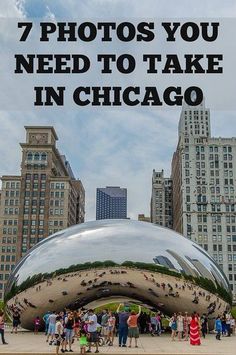 many people are standing in front of a large metal object that looks like a bean bag