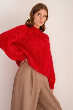 "The Relaxed Mohair Sweater is skillfully hand knitted in our premium Italian mohair blend. Lightweight yet super warm, it is the perfect cozy layer for winter. Designed for a relaxed fit, this sweater is so flattering and comfortable, you'll never want to take it off. It has an oversized and slightly cropped shape with a classic mock neck and raglan sleeves. Handcrafted in Greece. DETAILS * Super soft, premium quality Italian mohair * Composition: 60% kid mohair, 40% microfiber * Hand wash in c Red Sweater Knit, Red Mohair Sweater, Casual Red Mohair Sweater, Red Chunky Knit Turtleneck Sweater, Red Oversized Knitted Sweater, Red Hand Knitted Crew Neck Sweater, Oversized Red Knitted Sweater, Red Hand Knitted Long Sleeve Sweater, Hand Knitted Red Long Sleeve Sweater