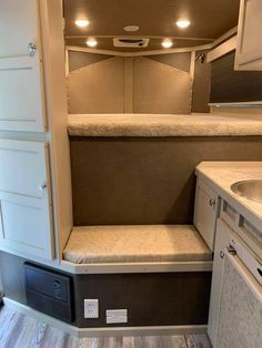 the inside of a camper with its door open and no one in it is shown