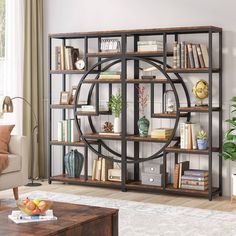 a living room filled with furniture and a book shelf