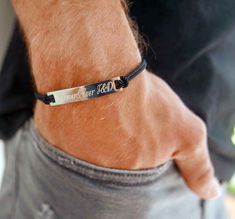 "Men's Engraved Bracelet - Men's Personalized Bracelet - Men's Custom Bracelet - Message Bracelet - Husband Gift - Anniversary Gift The simple and beautiful bracelet combines black fabric and set with a stainless steel palette which you can engrave on it names, dates, coordinates, roman numerals and signes. Bracelet comes with a 2\" (5 cm) extension chain. Need a different length just write it to me in the \"message to the seller\" box of the order form. These make the perfect gift. Every purcha Mens Bracelet Personalized, Custom Engraved Bracelet, Best Friend Bracelet, Friend Bracelet, Personalized Leather Bracelet, Bracelet Initial, Message Bracelet, Handmade Leather Bracelets, Custom Bracelet