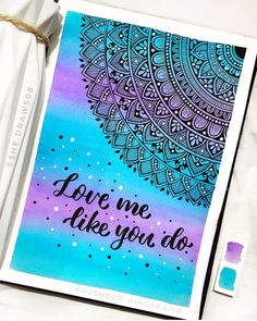 a card with the words love me like you do written in purple and blue ink