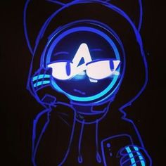 a lit up bear with glasses on it's head in the dark and holding a cell phone