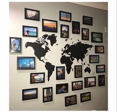 a wall with many different pictures and a world map on it's back drop