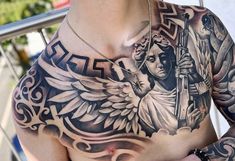 a man with an angel tattoo on his chest