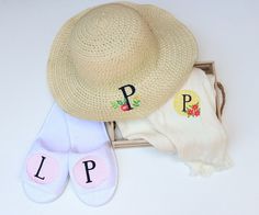 a hat, slippers and socks are sitting on a white surface