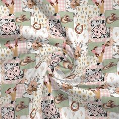 a pink and white checkered fabric with an animal design on the front, in various colors