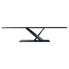 a black table with an x design on the top and one leg in front of it