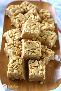 peanut butter fudge bars on a wooden platter