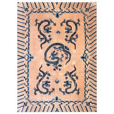 an old rug with blue dragon designs on it