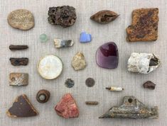 various rocks and stones laid out on a table