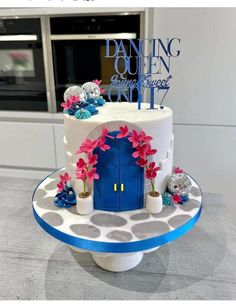 a cake that is sitting on top of a table in front of a window and door