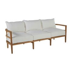 a wooden couch with white pillows on it's back and arm cushions, against a white background