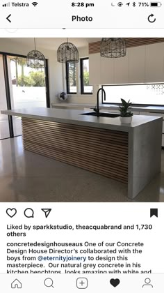 an instagramted photo of a kitchen counter top and island in the middle of a room