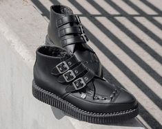 Keep your style sharp with these rocker ankle creeper boots that offers our same bold, iconic style in a vegan alternative option. Features an all-black upper made of our high quality TUKskin™ material — polishable synthetic faux leather that is both soft and breathable. Has a three-strap metal buckle closure with a low sole platform that measures approximately 1 ¼” at the heel and ¾” in the front. Includes removable gel insoles for added comfort. Shoe can be easily cleaned with mild soap and wa Black Creepers, Tuk Shoes, Creeper Boots, Pointed Boots, Comfort Shoe, Wing Shoes, Boot Straps, Most Comfortable Shoes, Pointed Toe Boots