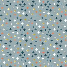 a blue background with crosses and dots in different colors on the same fabric, as well as an orange one