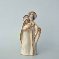 a ceramic figurine of two people holding each other