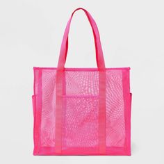 Whether it's time for a casual outing with friends or a trip to the farmers' market, you can carry all your essentials in the Mesh Tote Handbag from Shade & Shore™. This unstructured tote handbag has a mesh design to help you see through to the contents inside. It features an open main compartment along with front and side pockets to help keep water bottles and small items separate, and with the double handles, it's easy to carry over your shoulders or in hand. Shade & Shore™: Found exclusively Graduation Gifts For Friends, Sleepover Bag, Boat Tote, Mesh Tote Bag, Open Main, Beach Essentials, Crochet Tote, Pink Tote, Holiday Wardrobe