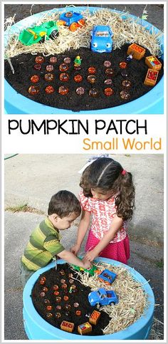 two children playing with pumpkin patch small world in a blue plastic bowl filled with dirt