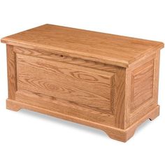 a wooden chest sitting on top of a white floor