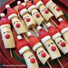 some strawberries with faces on them and marshmallows in the shape of people