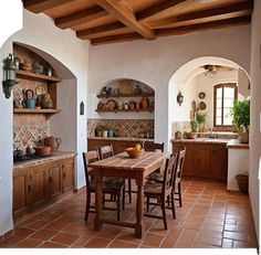 a dining room table and chairs in front of an archway with potted plants on it