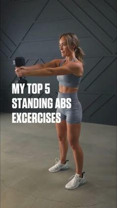 a woman in grey top and shorts holding a black object with the words my top 5 standing abs exercises