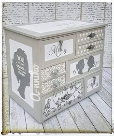 the drawers are decorated with silhouettes and words