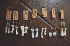 An assortment of coyote and bobcat toe bone earrings, plus a pair of otolith bones (second in from right), with various beads and stones. You can find pieces like this and more at www.deadthingsbysarah.com!