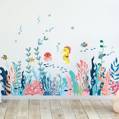 an underwater scene with fish, seaweed and corals on a white wallpapered room