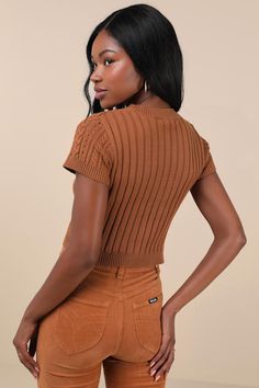 Your autumn style will be truly special a with trendy must-have like the Lulus Modish Ways Rust Brown Cable Knit Short Sleeve Sweater Top! This soft and stretchy sweater boasts a variety of classic designs, including cable, seed, and ribbed knit textures (plus pierced detailing), that makes this piece truly unique. A timeless crew neckline and a fitted, cropped bodice are framed by cute short sleeves, while contrasting ribbed knit trim at the neckline, cuffs, and hem completes the look. Fit: Thi Stretch Trendy Cardigan, Fitted Soft Knit Cropped Sweater For Fall, Trendy Brown Knit Top For Layering, Brown Ribbed Knit Cardigan, Fitted Textured Knit Cropped Sweater For Fall, Brown Knitted Crew Neck Top, Brown Textured Knit Crew Neck Top, Brown Soft Knit Top For Layering, Fall Cropped Cable Knit Sweater With Stretch