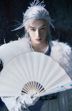 a woman with white hair is holding a fan