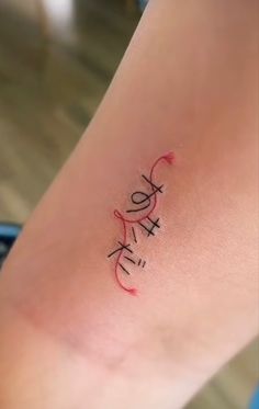 a woman's leg with the word love written in cursive writing on it